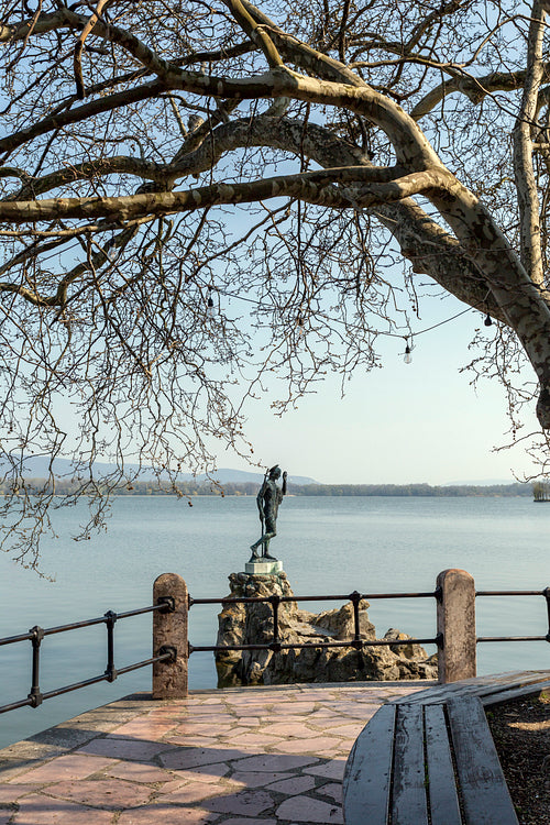 The old lake in Tata, Hungary with the statue of Saint John.