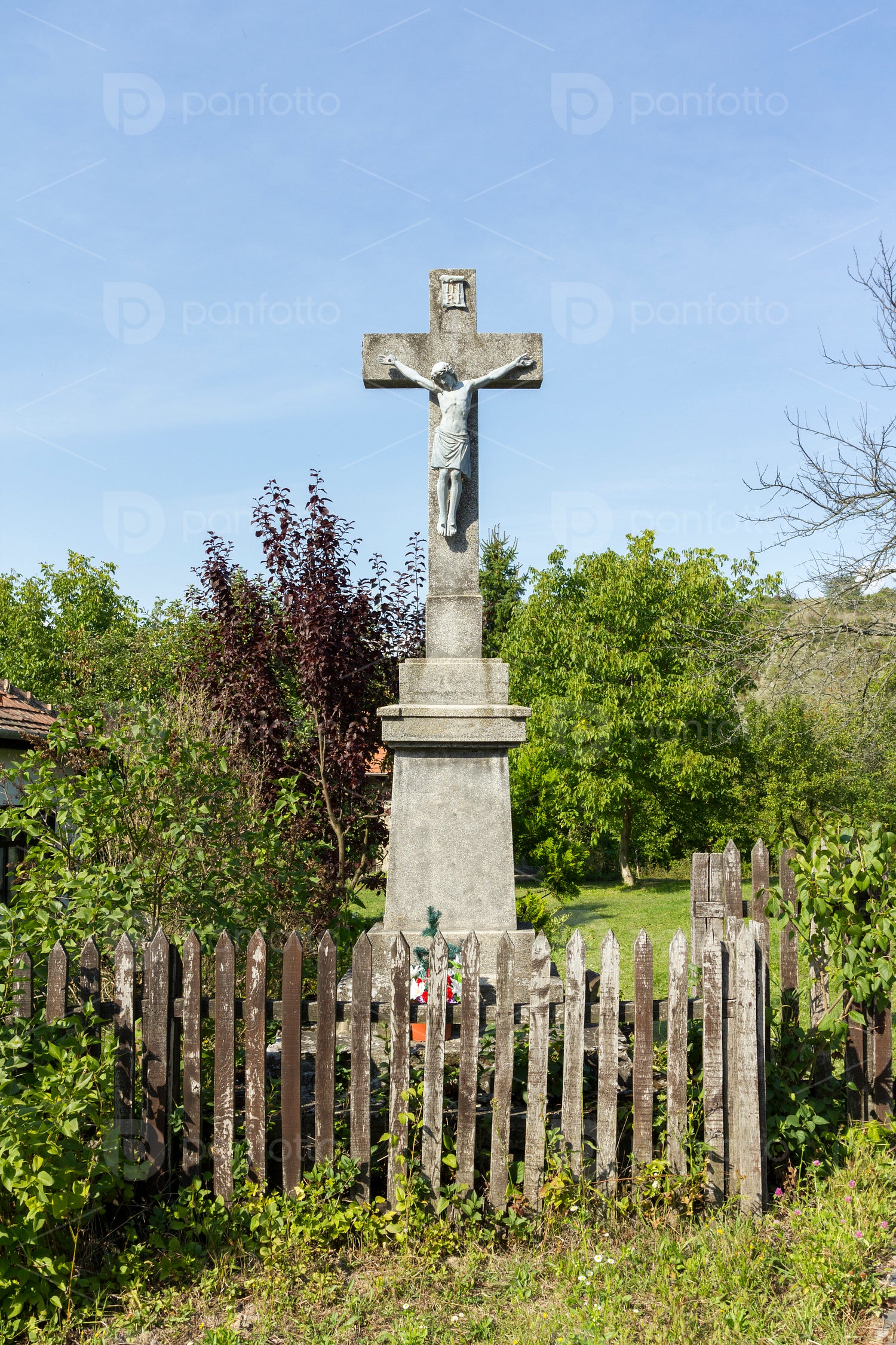Stone cross in Hollókő