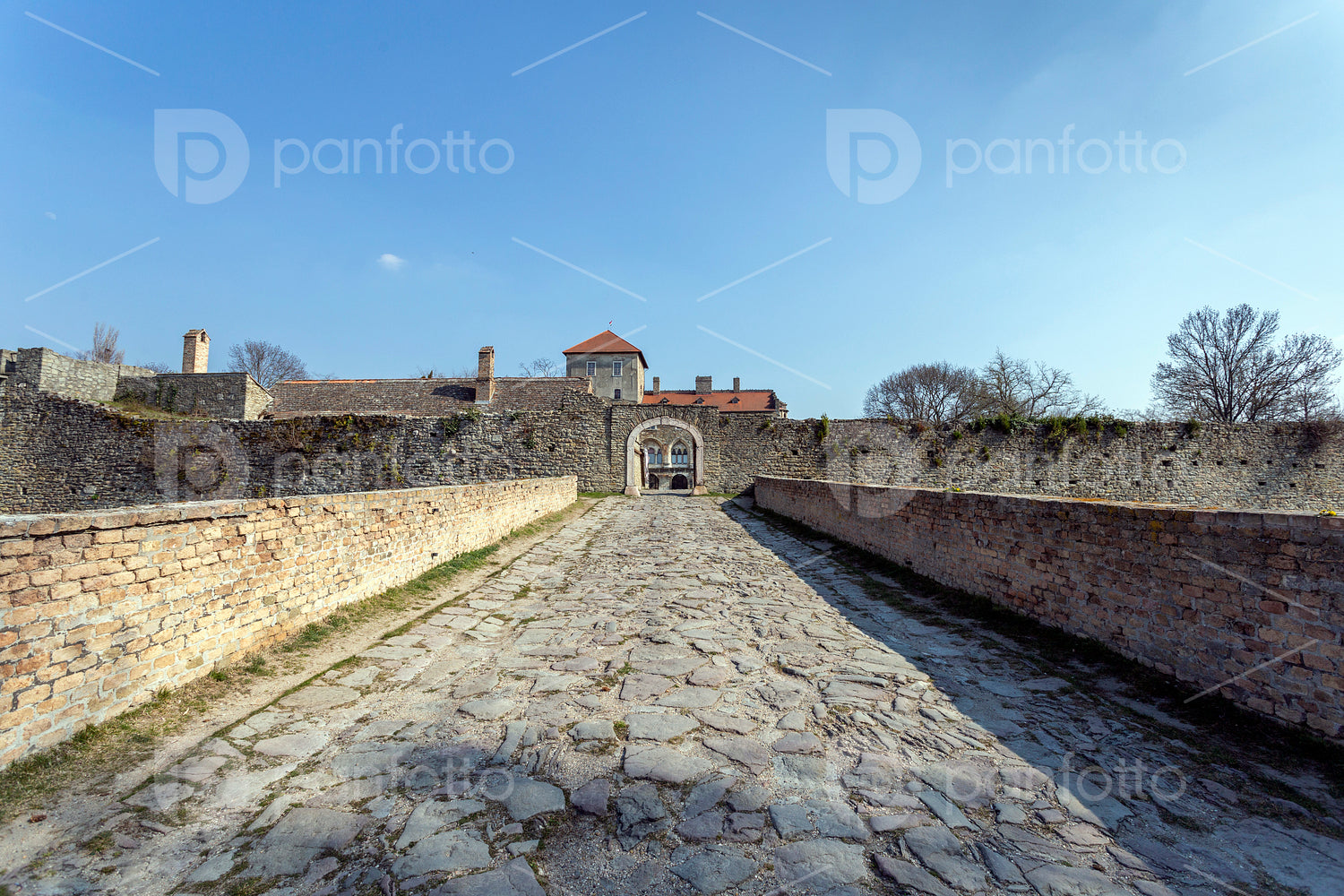 The gate of the Tata castle on a sunny spring day.