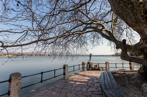 The old lake in Tata, Hungary with the statue of Saint John.