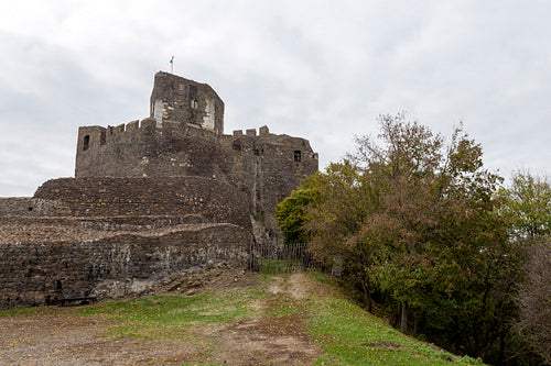 Hollókő castle on a cloudy autumn day