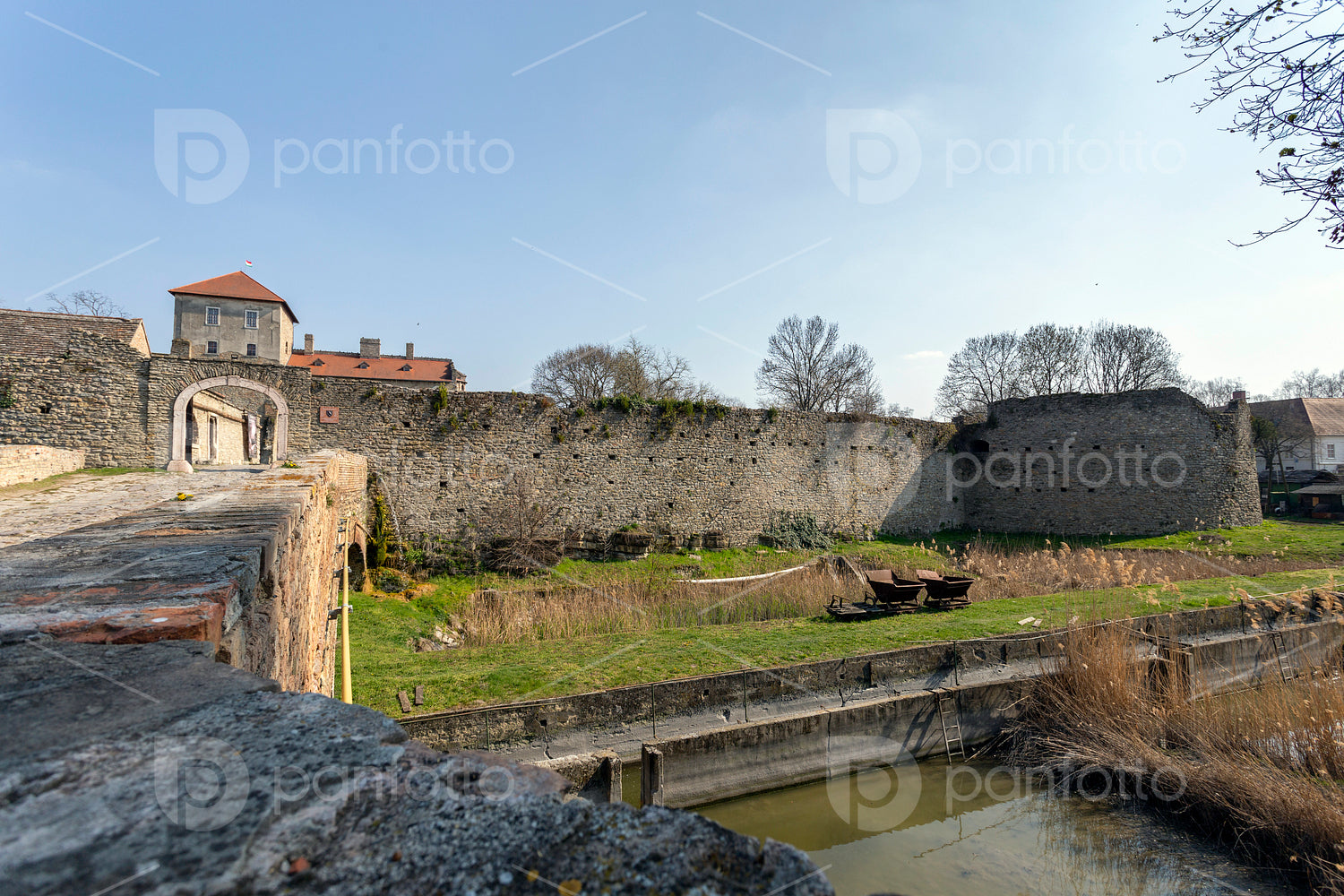 The gate of the Tata castle on a sunny spring day.