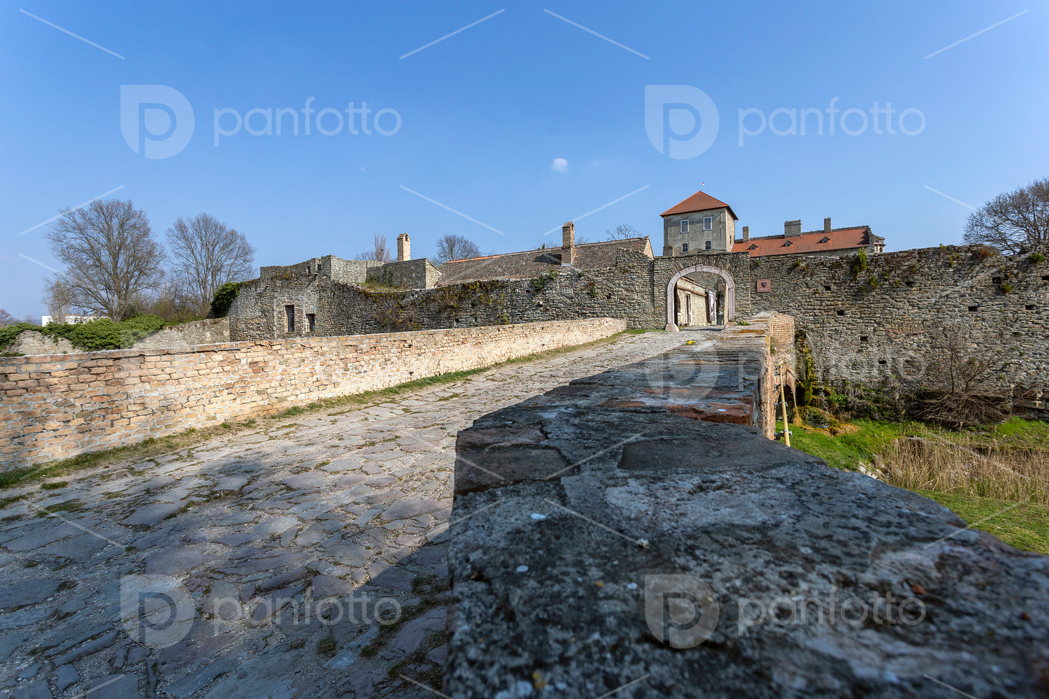 The gate of the Tata castle on a sunny spring day.