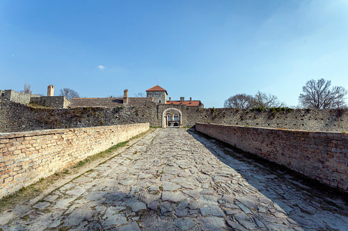 The gate of the Tata castle on a sunny spring day.