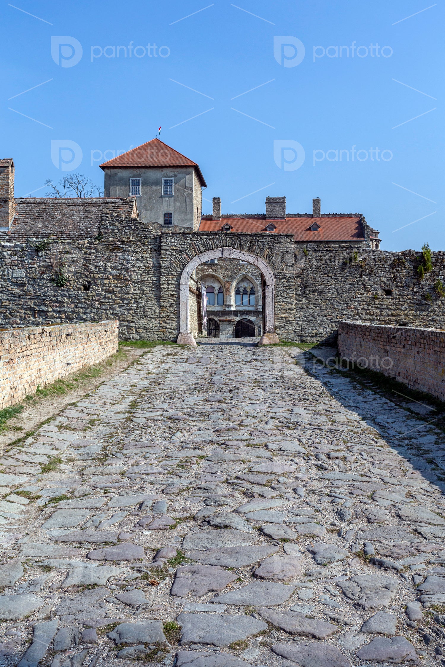 The gate of the Tata castle on a sunny spring day.