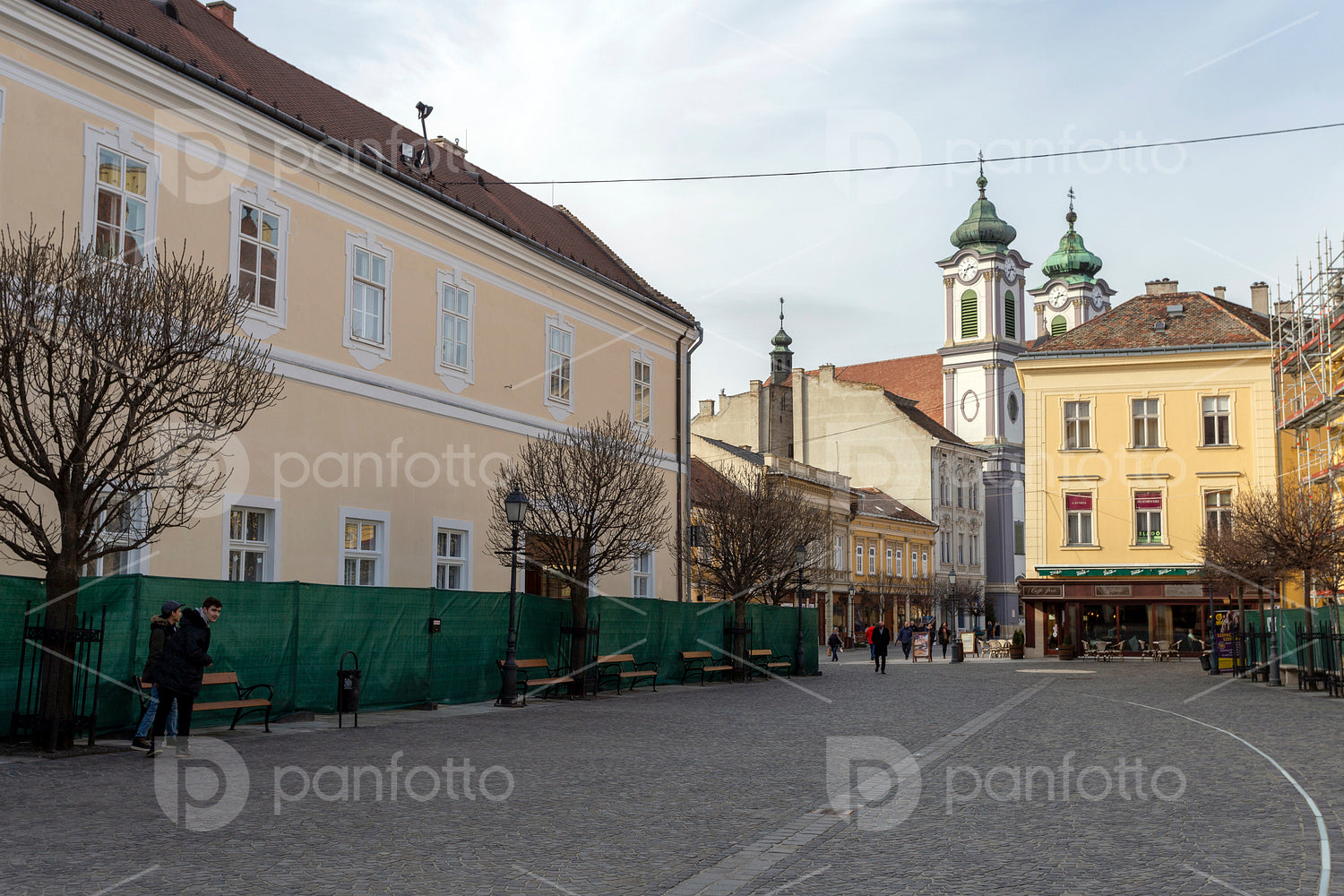 Cobblestone street in Székesfehérvár on a winter day.