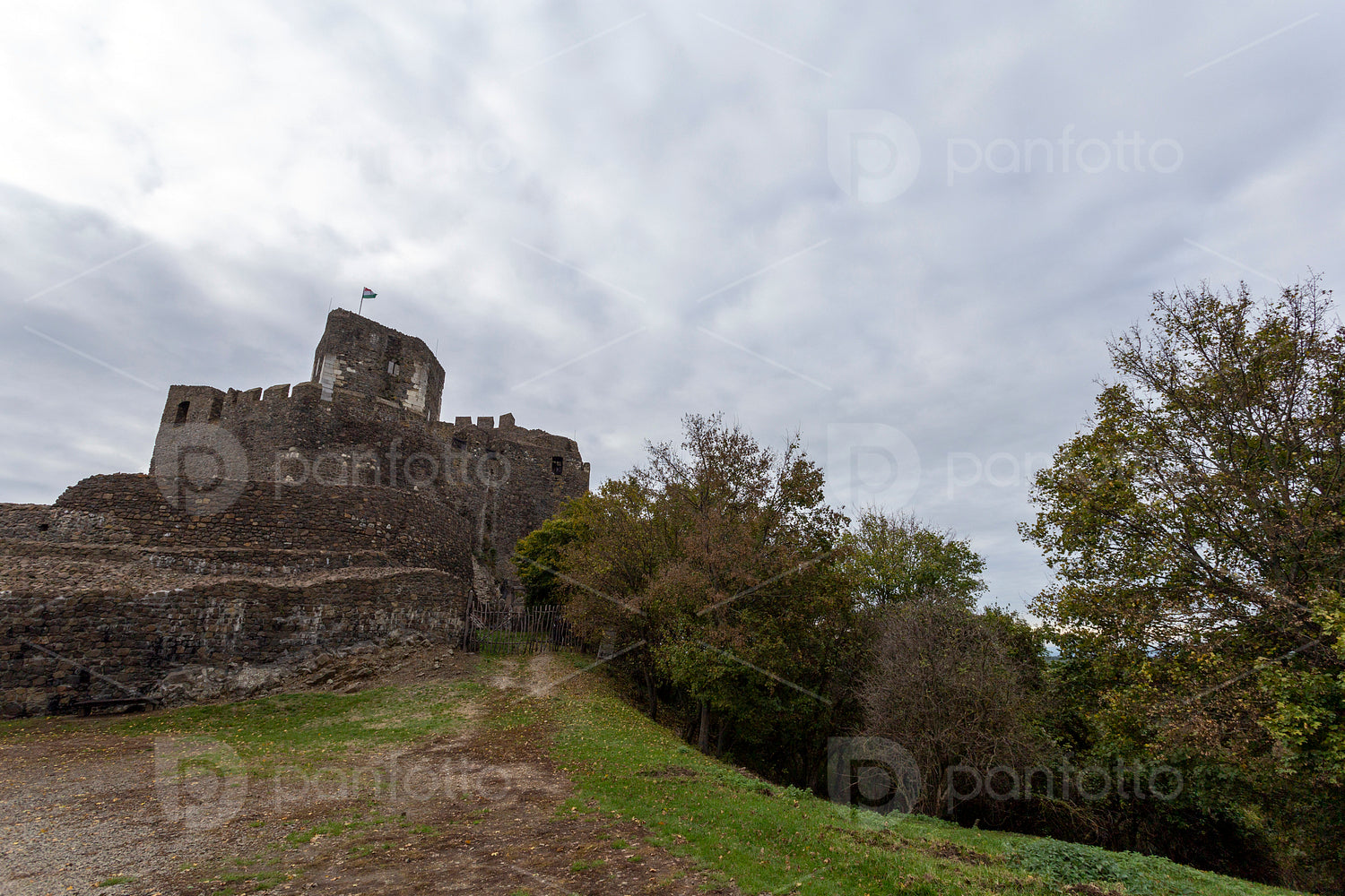 Hollókő castle on a cloudy autumn day