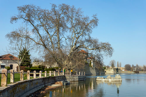 The old lake in Tata, Hungary with the statue of Saint John.